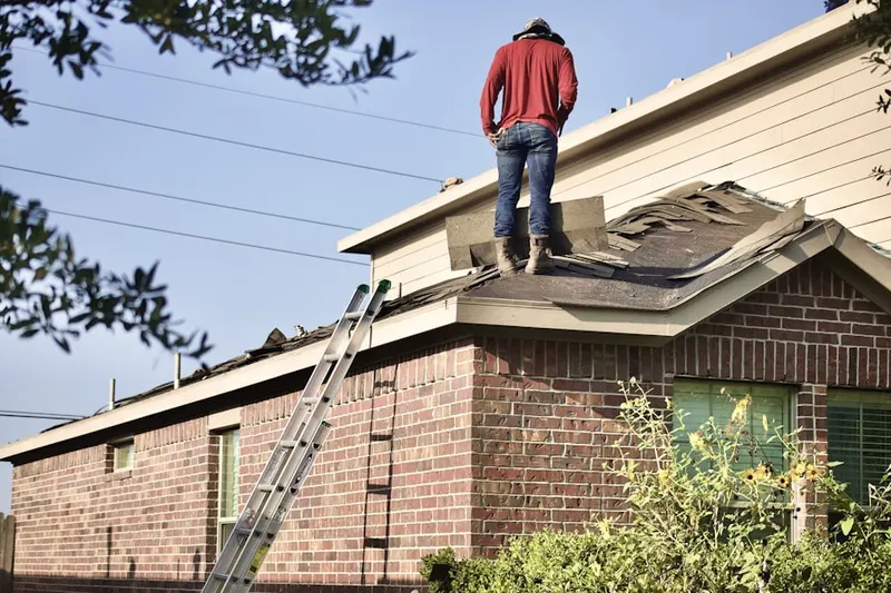 Professional roofer working on a residential roof in Edgewood Estates